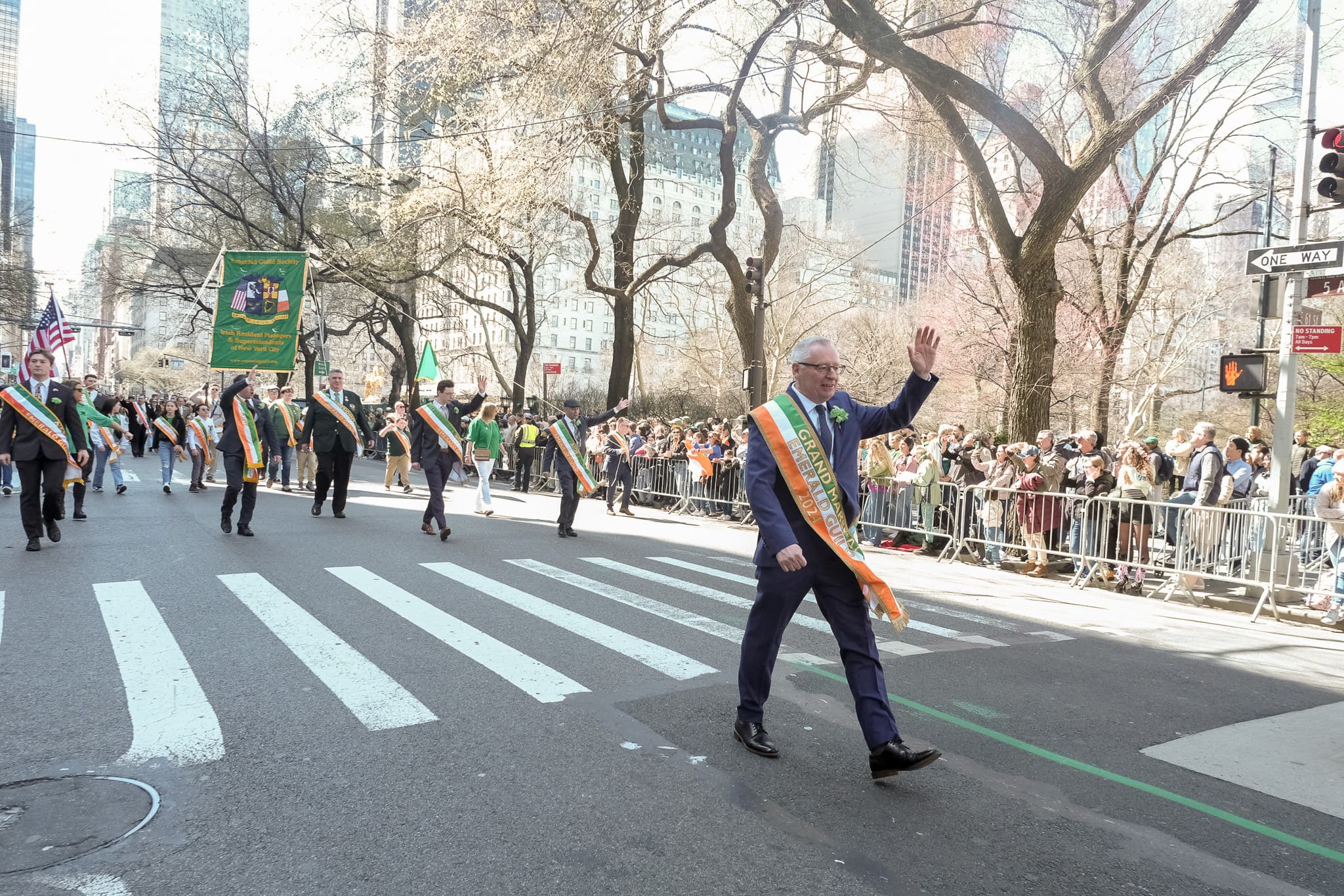 2024 Emerald Guild Society Grand Marshal leading the Society through the St. Patrick's Day Parade in New York City.