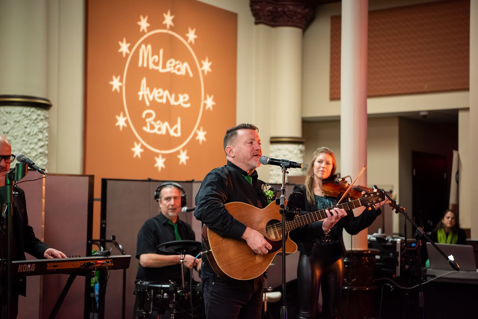 Musicians performing on stage during the Guild's 2026 St. Patrick's Day gathering.