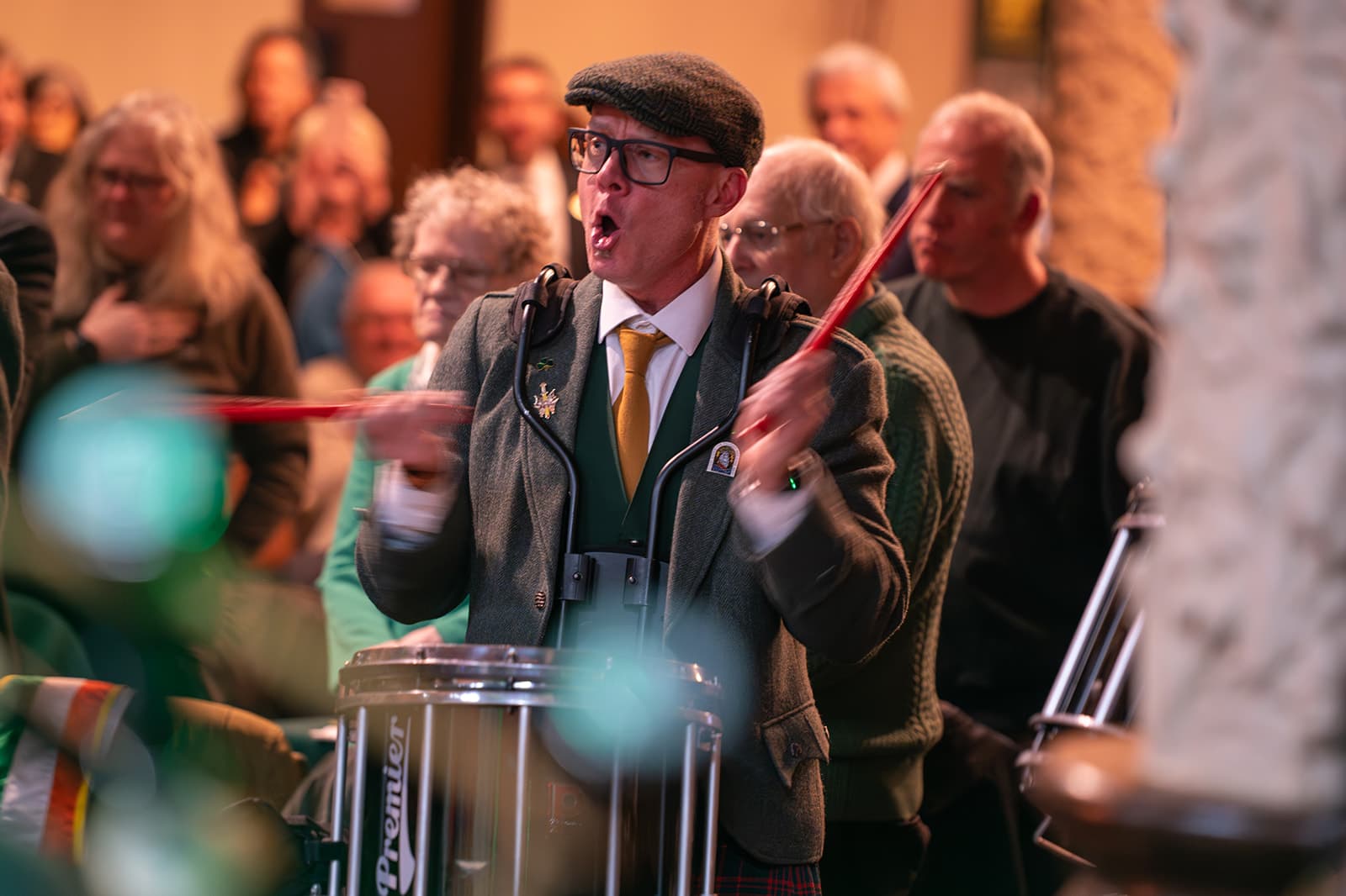 Pipe band performer playing during the Guild's 2026 St. Patrick's Day gathering.