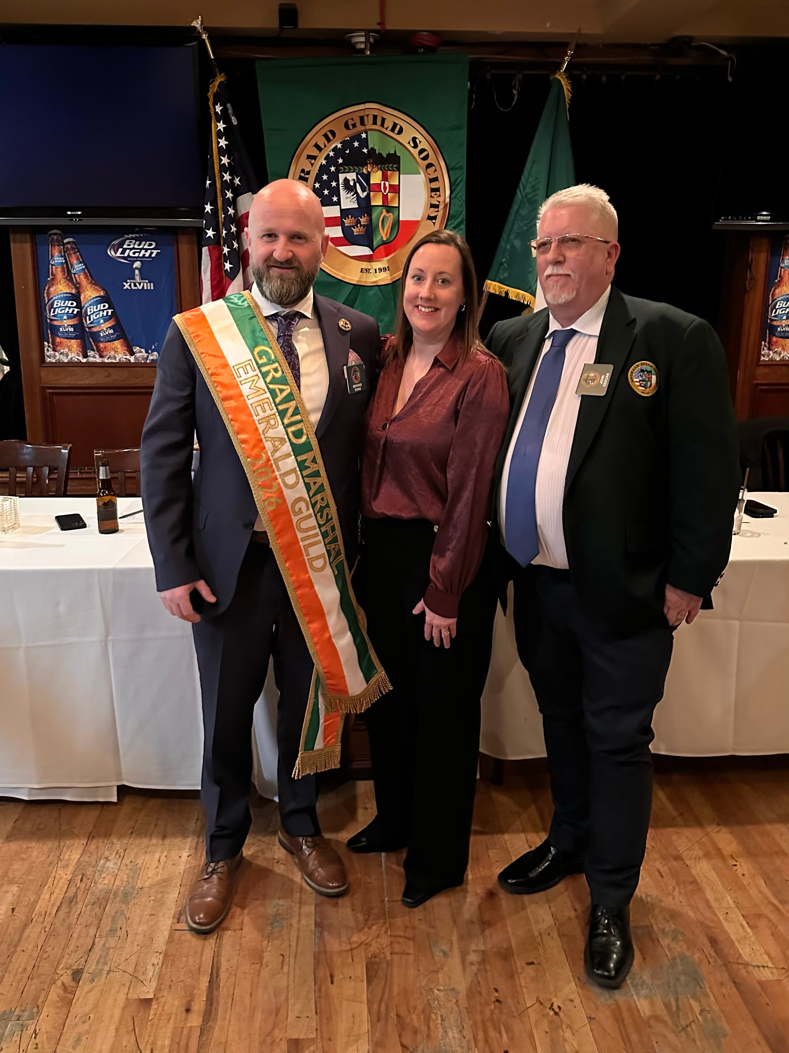 Bernard Dunne pictured at the Guild's 2026 Grand Marshal celebration beside fellow attendees and the Guild banner.