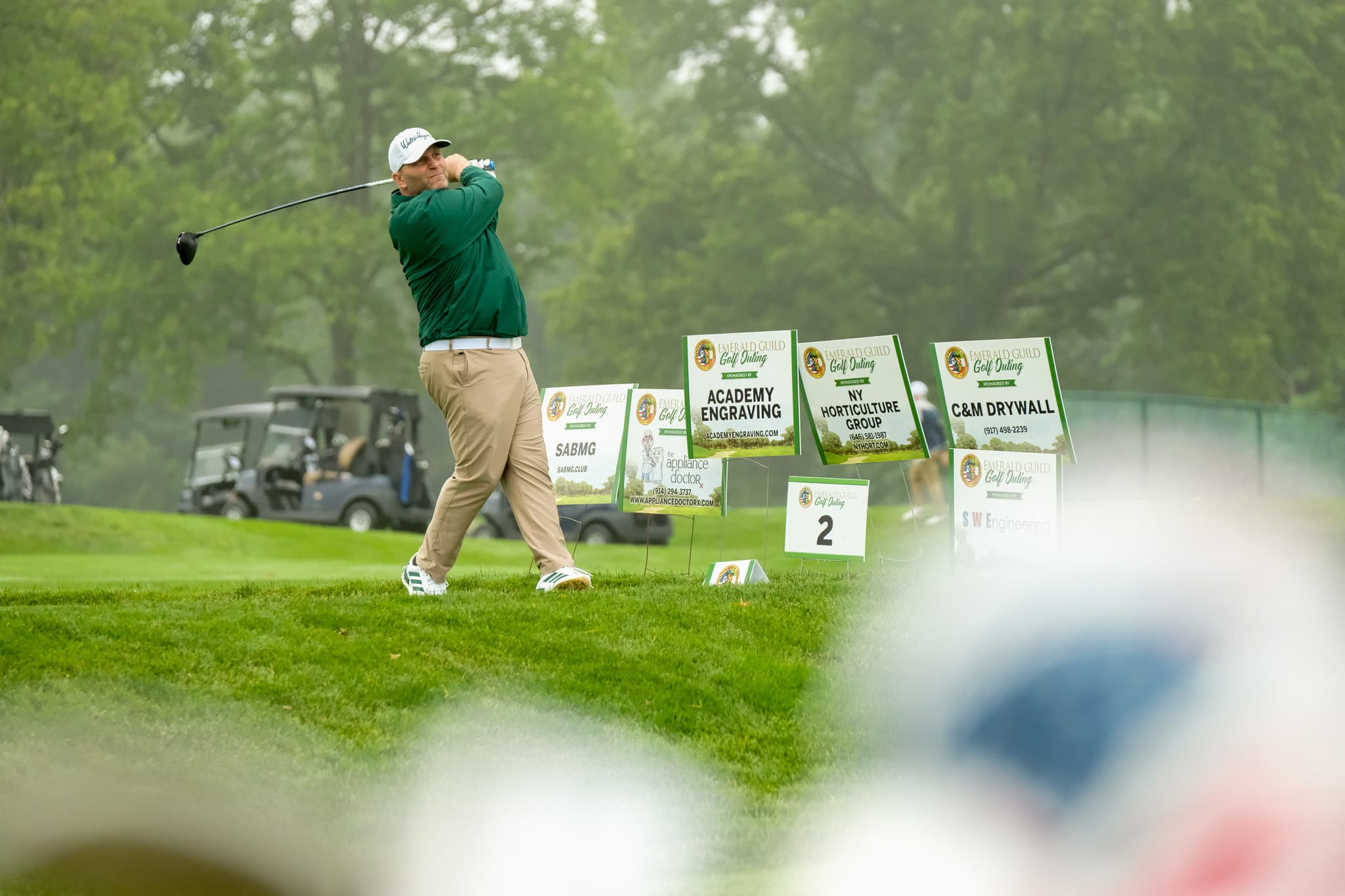 Golfer teeing off during the 2025 Timmy O'Connor Memorial Golf Outing.